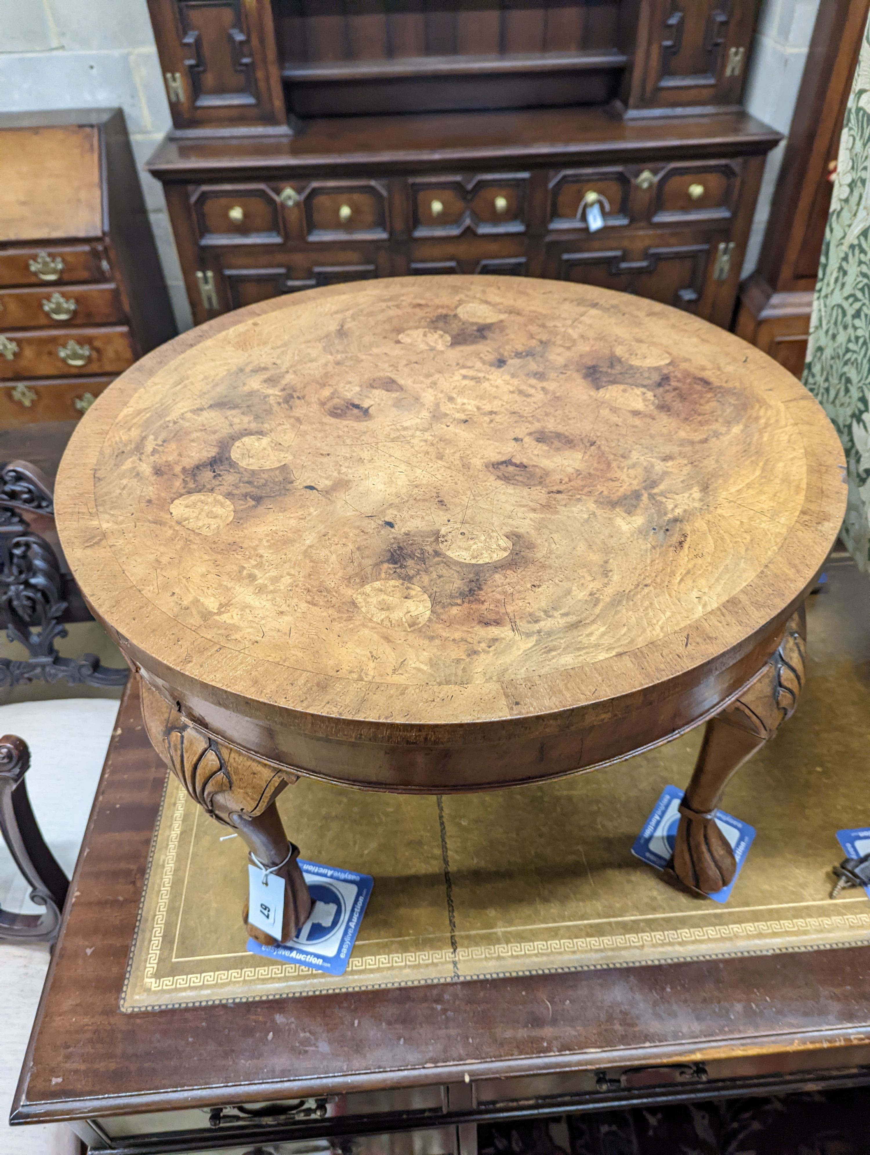A Queen Anne revival circular walnut occasional table, diameter 60cm, height 40cm together with an Arts & Crafts mirrored oak coat rack
